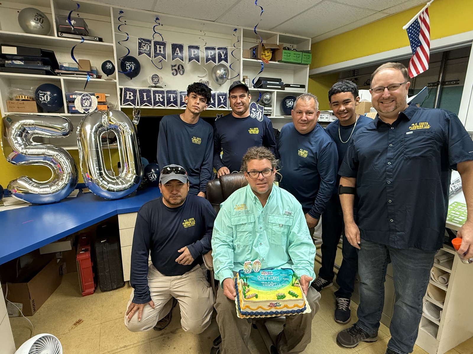 The E. Costa Plumbing & Gas crew gathered in the warehouse to celebrate a team birthday