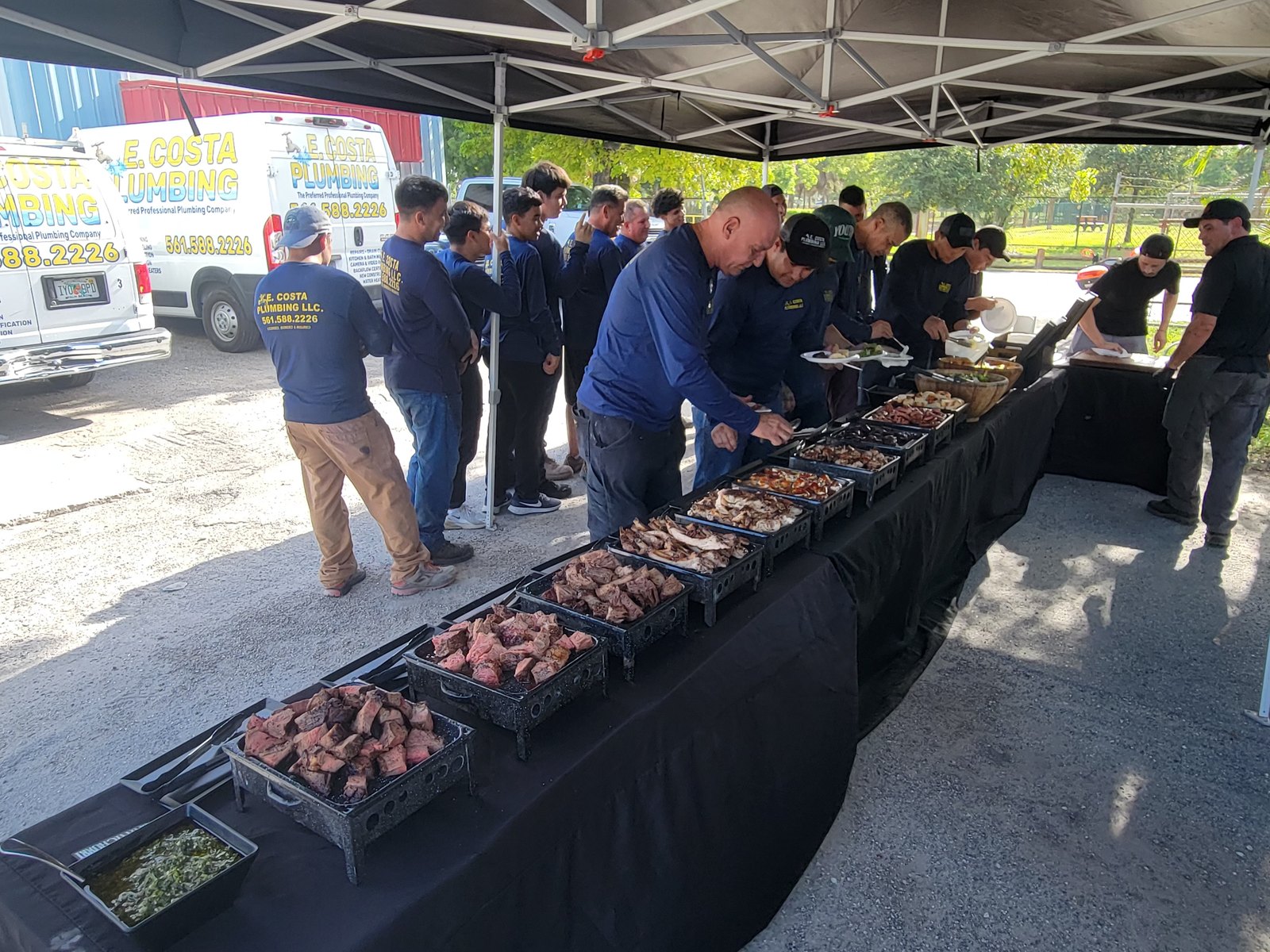 The E. Costa Plumbing & Gas team together at a weekend cookout outside the West Palm Beach shop