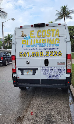 E. Costa Plumbing service van with company logo and phone number, parked under palm trees in West Palm Beach